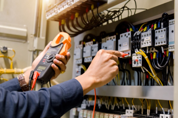 electrician checking electric panel